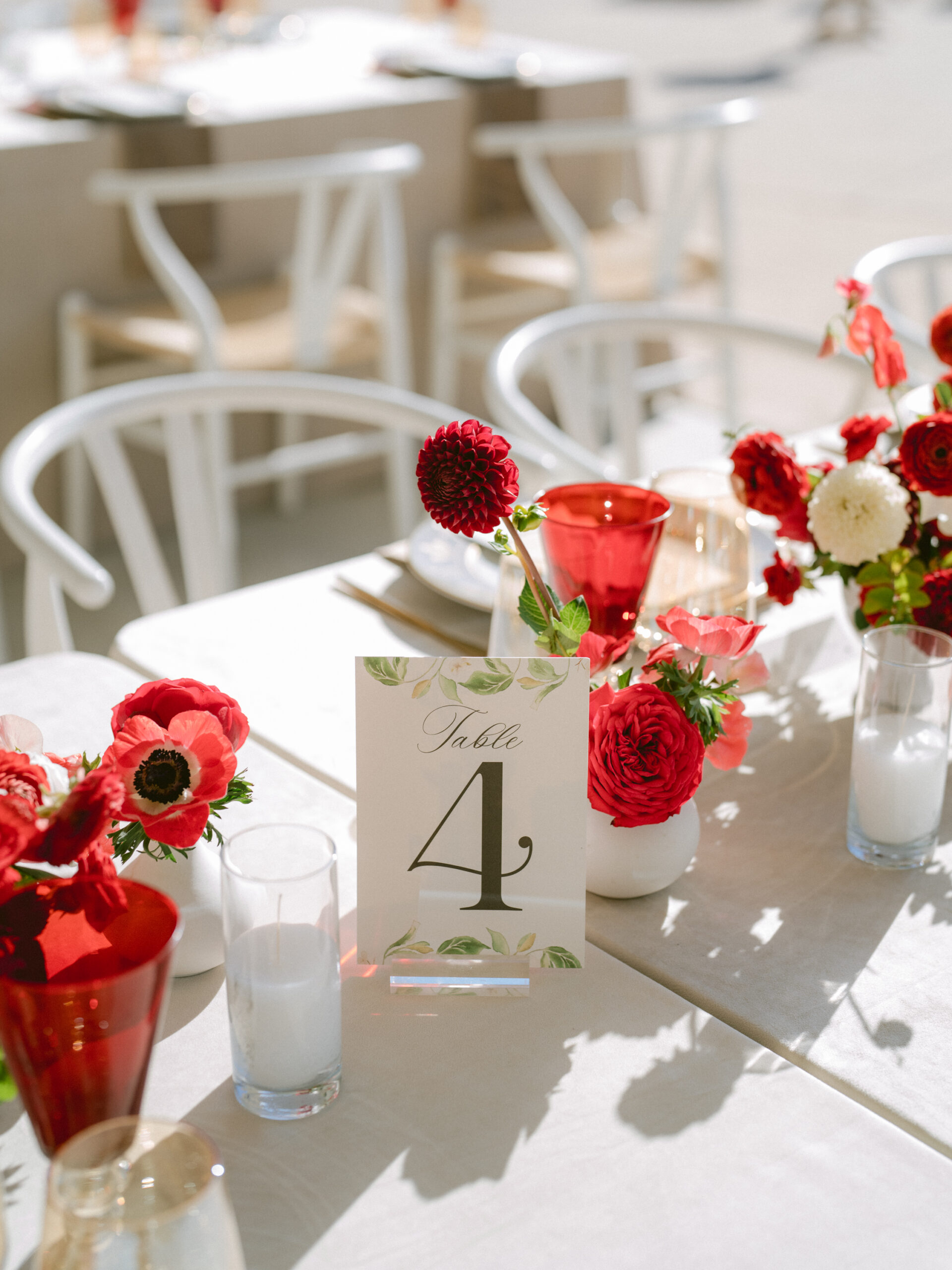 watercolor table number on a table with red flowers