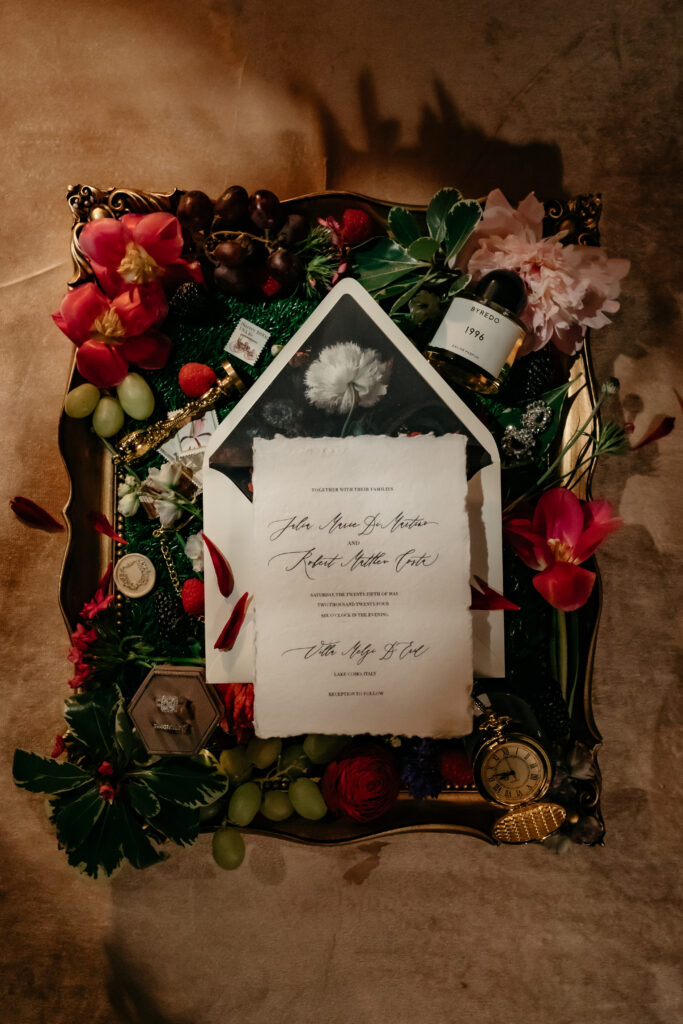 handmade paper wedding invitation suite with a moody floral liner