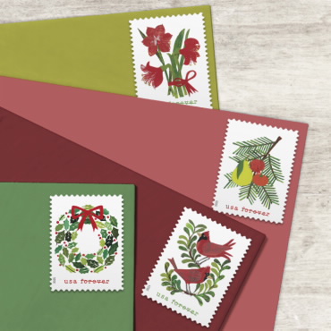 holiday stamps on red and green envelopes